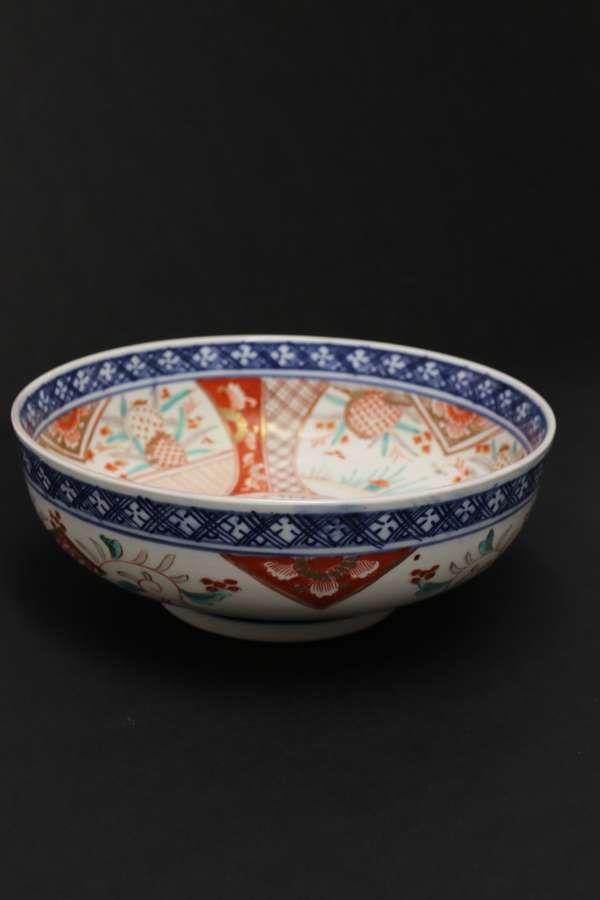 A Japanese Meiji Period Porcelain Bowl Hand Painted With An Imari Pattern Design.