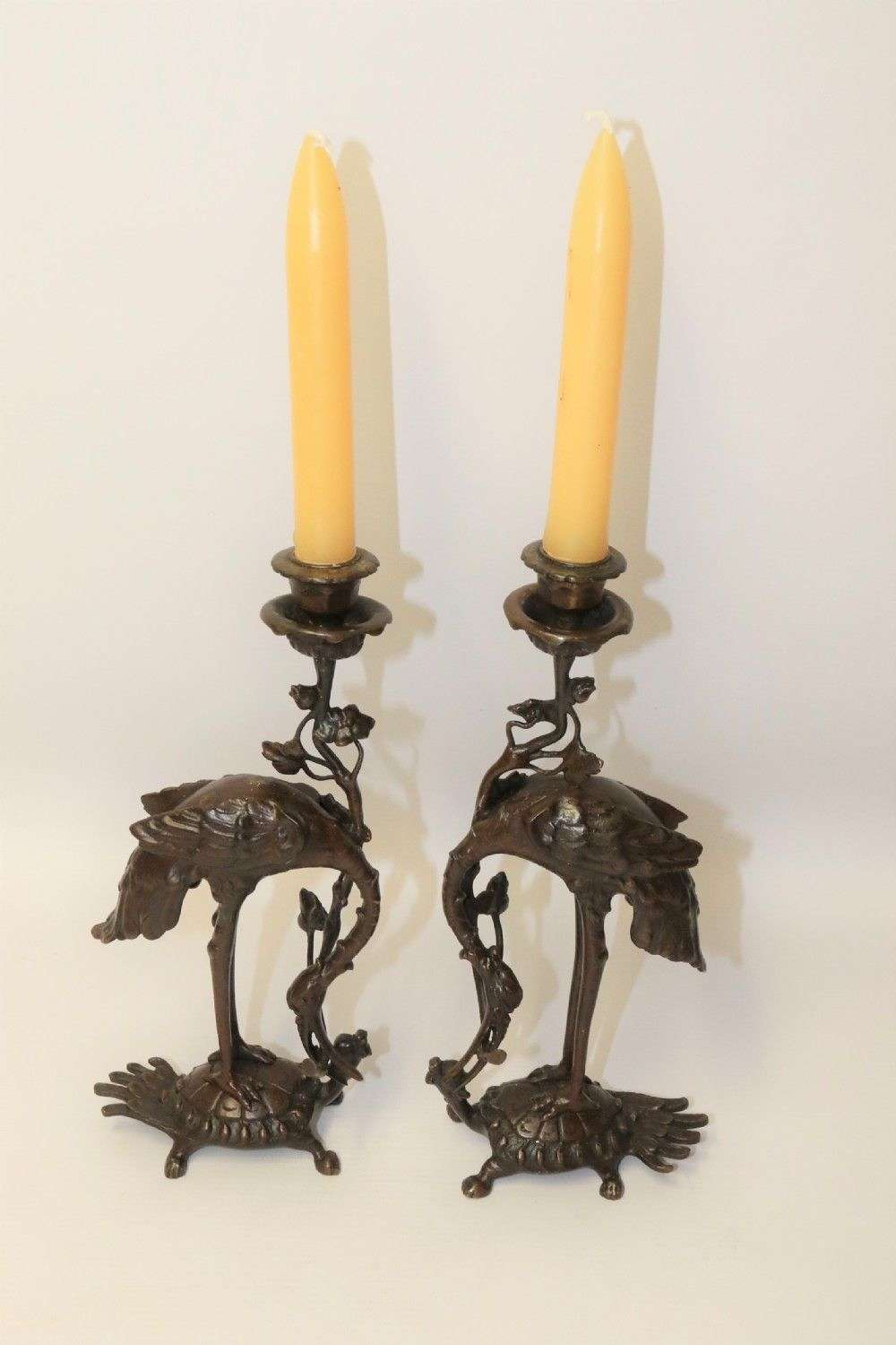 A Pair Of French Bronze Candlesticks In The Form Of Storks
