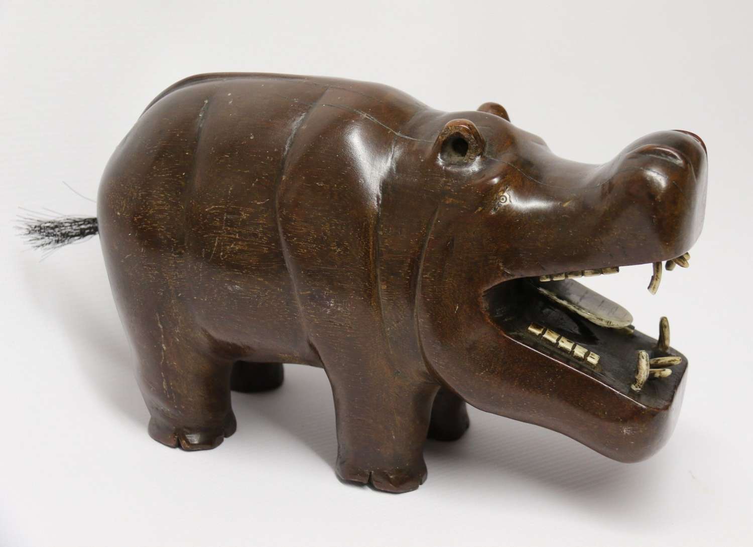 A Rare African Carved Hardwood And Bone Study Of A Hippopotamus