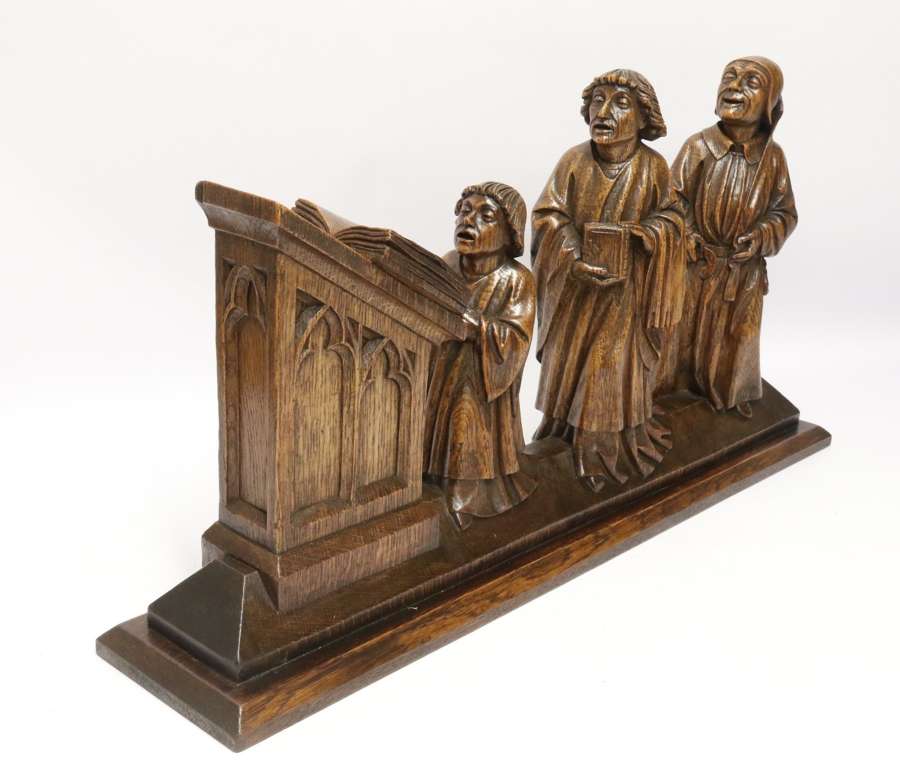 19th century Arts and Crafts carved figure group of three monks