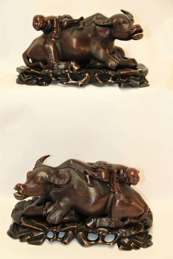 A Fine Pair Of Chinese Carved Hardwood Water Buffalos On Stands
