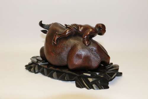 A Fine Pair Of Chinese Carved Hardwood Water Buffalos On Stands