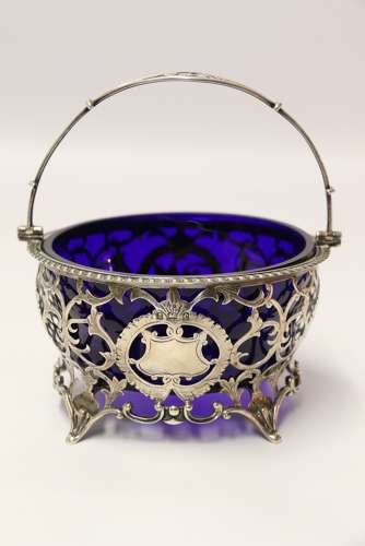 Edwardian period silver sugar basket with original blue glass liner