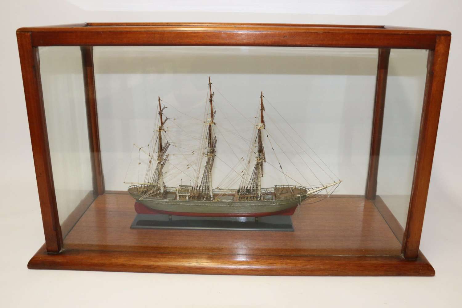 A Hand Modelled Ship In A Glass And Mahogany Case, C 1910