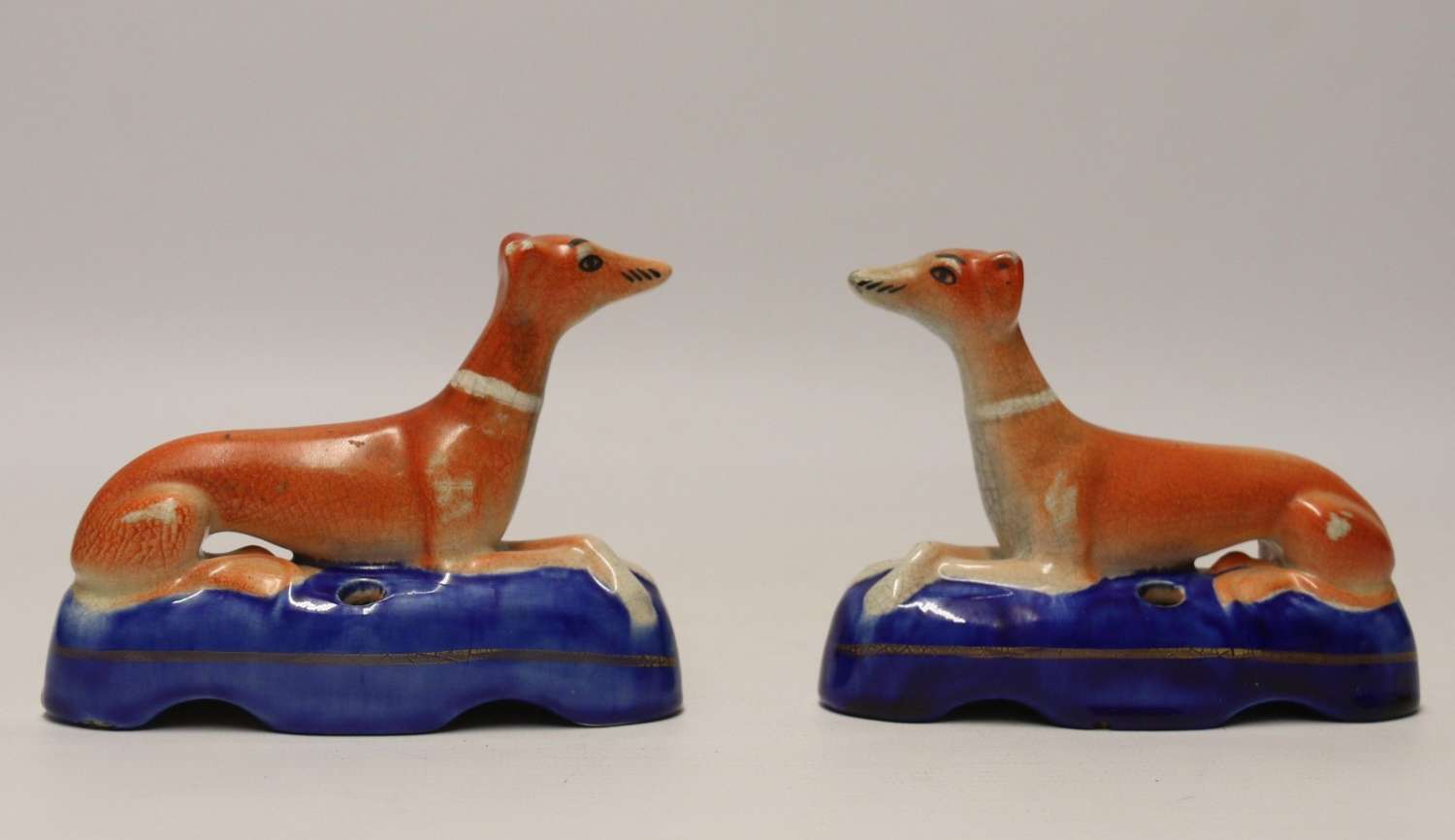 A Pair Of English Staffordshire Pottery Grey Hound Dogs. Mid 19th C