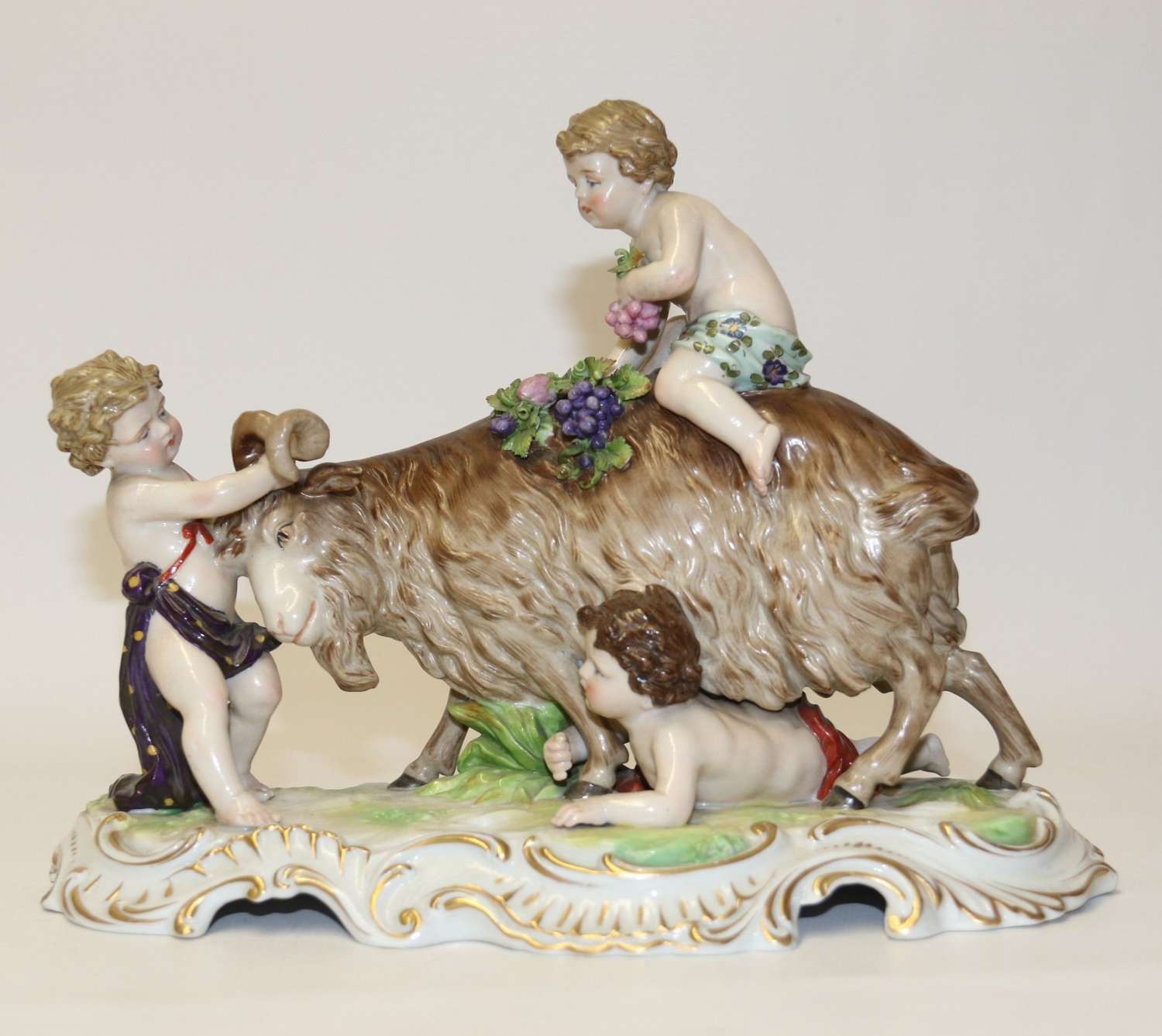 A Fine Porcelain Figure Group Of Three Putti Wrestling With A Goat By Hochst Factory