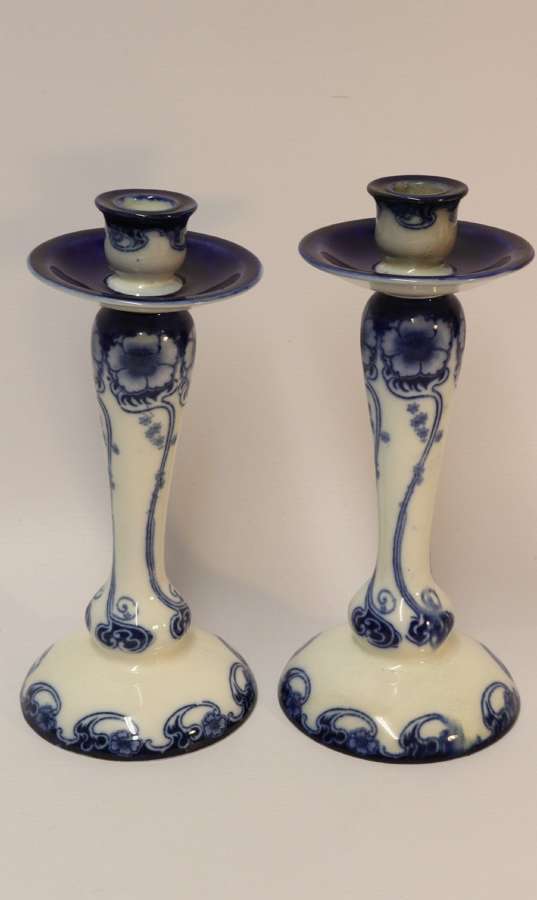 A Pair Of Art Nouveau Pottery Candle Sticks