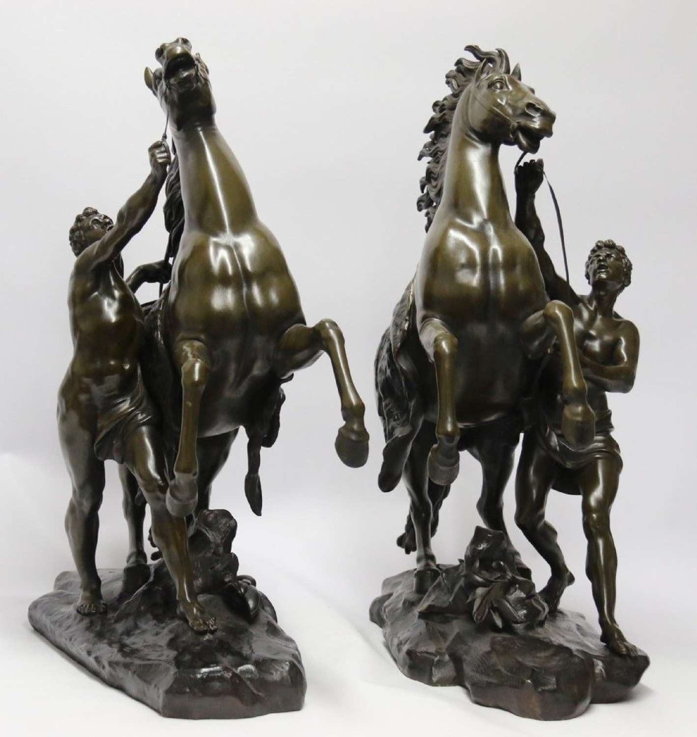 A Large Pair Of Bronze Marly Horses After Costou.