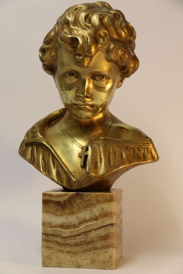 A Gilt Bronze Bust Of A Boy After Donatello