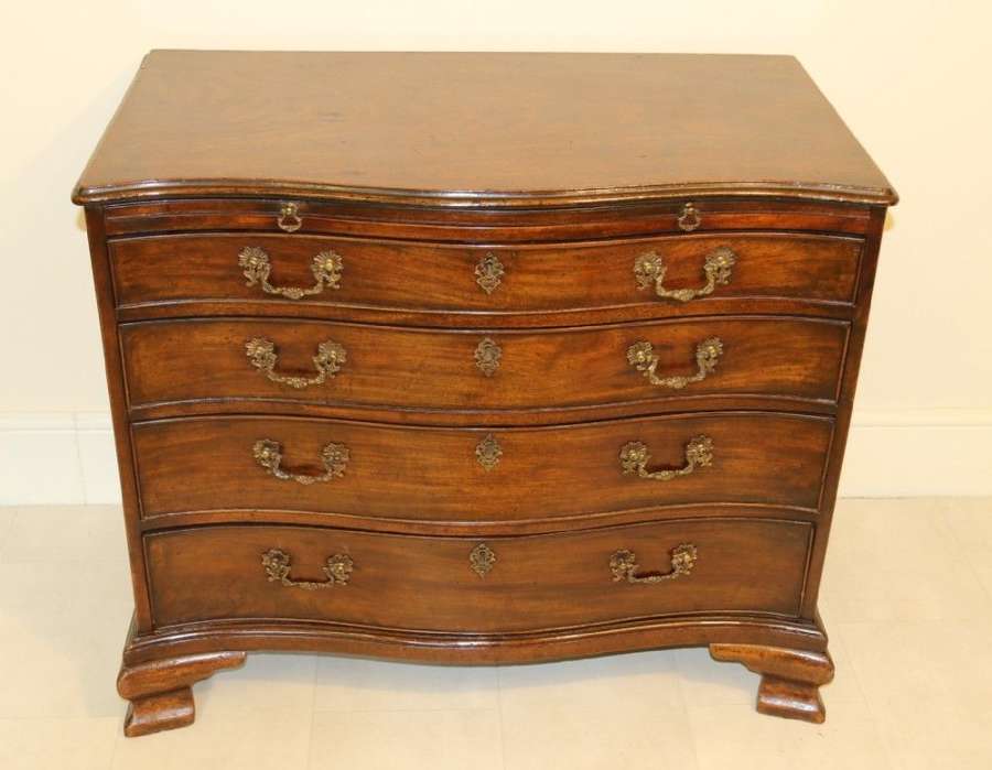 A Chippendale Period Serpentine Fronted Mahogany Chest Of Drawers
