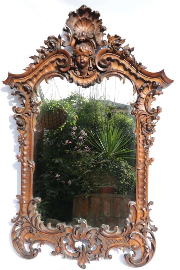 An Exquisitely Carved 19th Century Italian Walnut Mirror