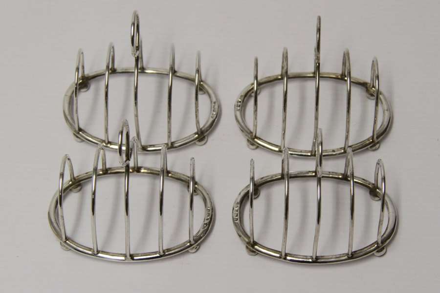 A Rare Set Of Four Silver Toast Racks