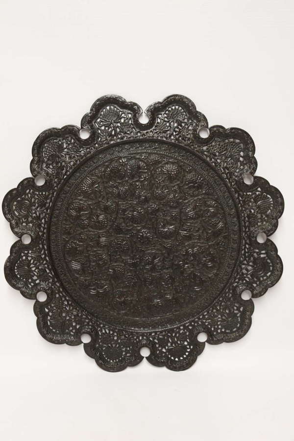 An Indian Raj period copper hand pierced and decorated wall charge