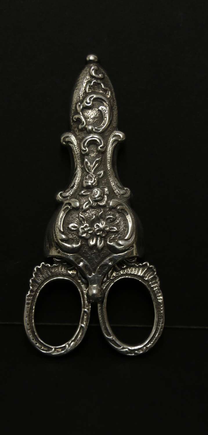 A fine pair of mid 19th C Silver scissors and sheath
