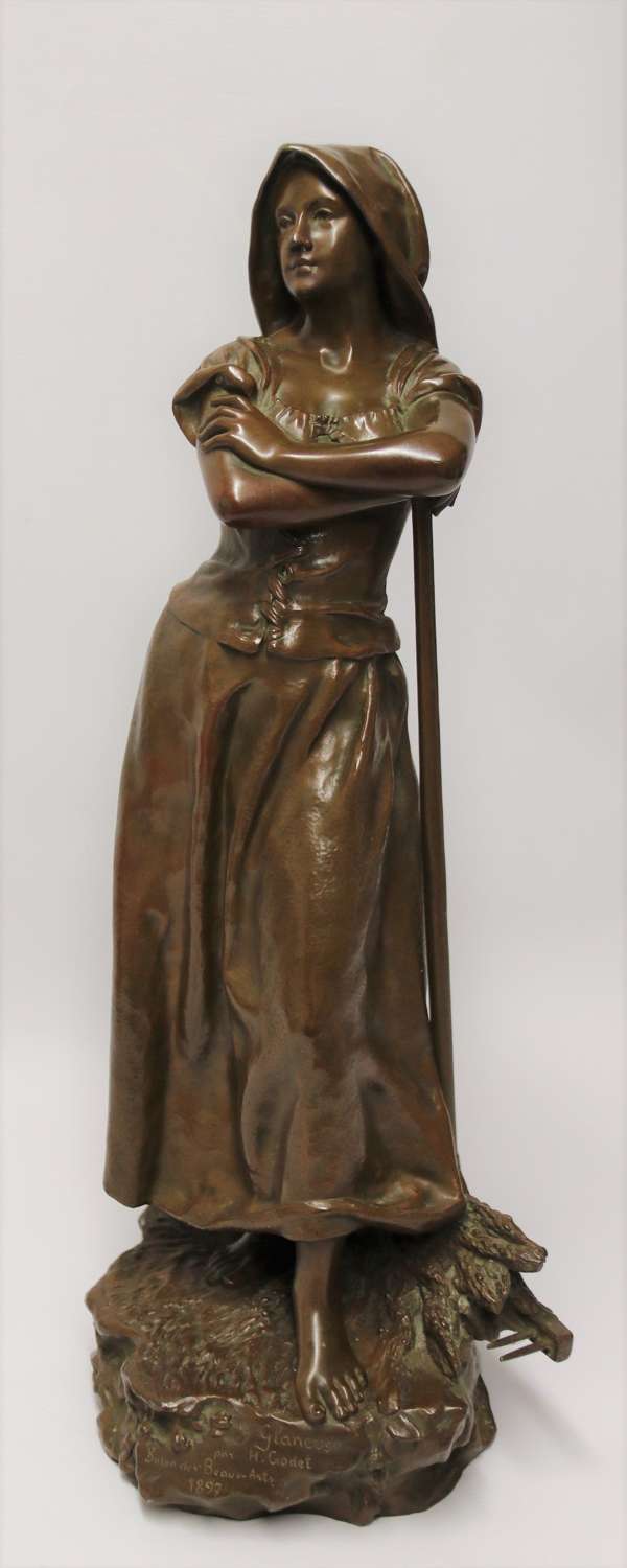 19th century bronze sculpture of a young female gathering hey