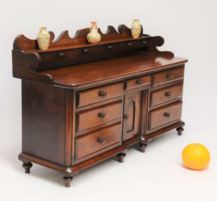 A rare miniature mid 19th century mahogany dresser base, Victorian