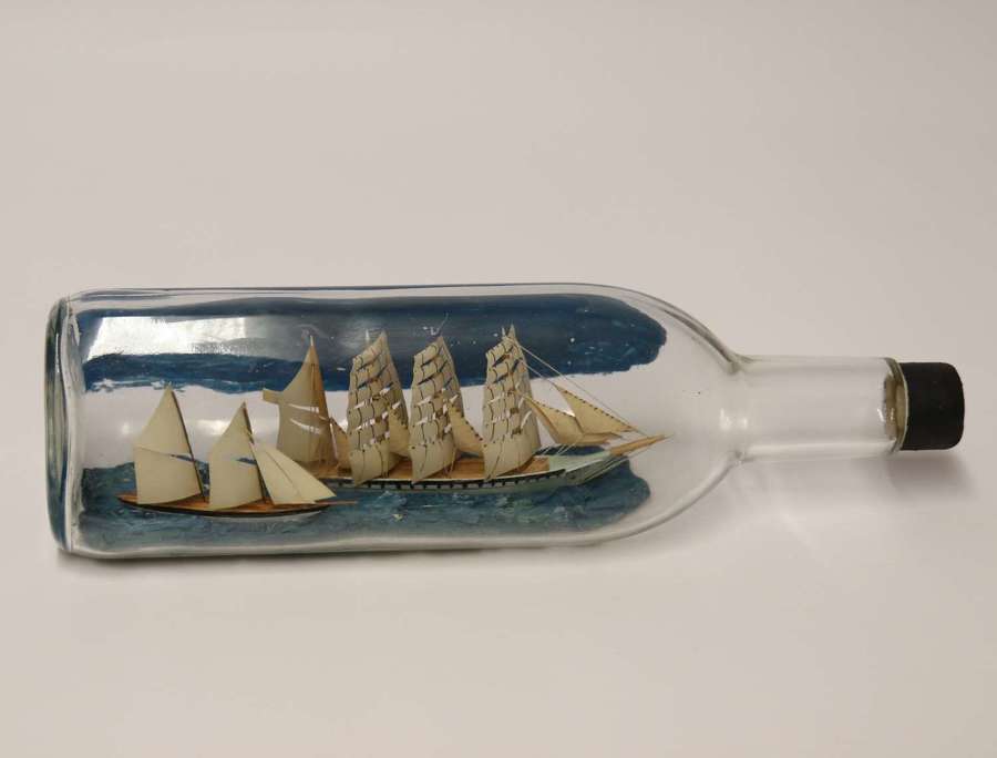 A fine folk art diorama with twin ships in a bottle, c 1930