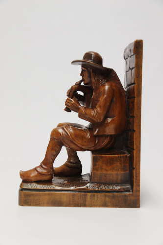 A fine pair of Black Forest carved walnut bookends, circa 1900
