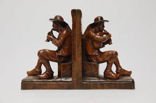 A fine pair of Black Forest carved walnut bookends, circa 1900