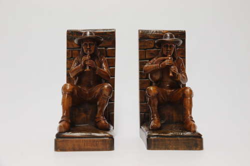 A fine pair of Black Forest carved walnut bookends, circa 1900