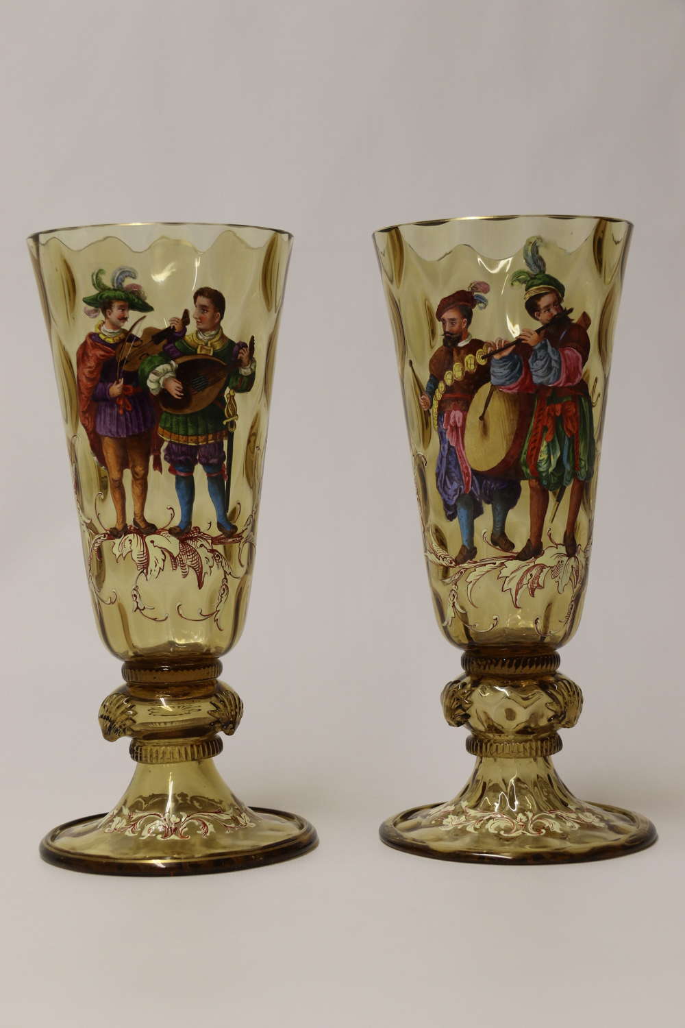 19th century pair of Bohemian figurative enamelled glass goblets C1860