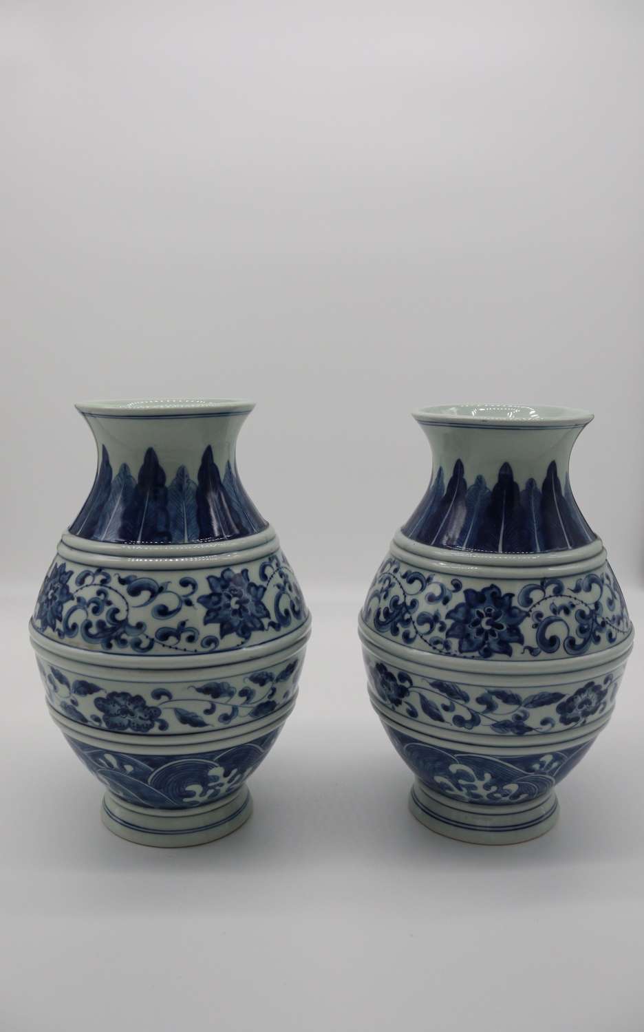 Pair of Chinese hand painted blue and white vases, circa 1930