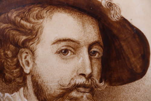 Continental hand painted pottery plaque depicting Rubens, circa 1900