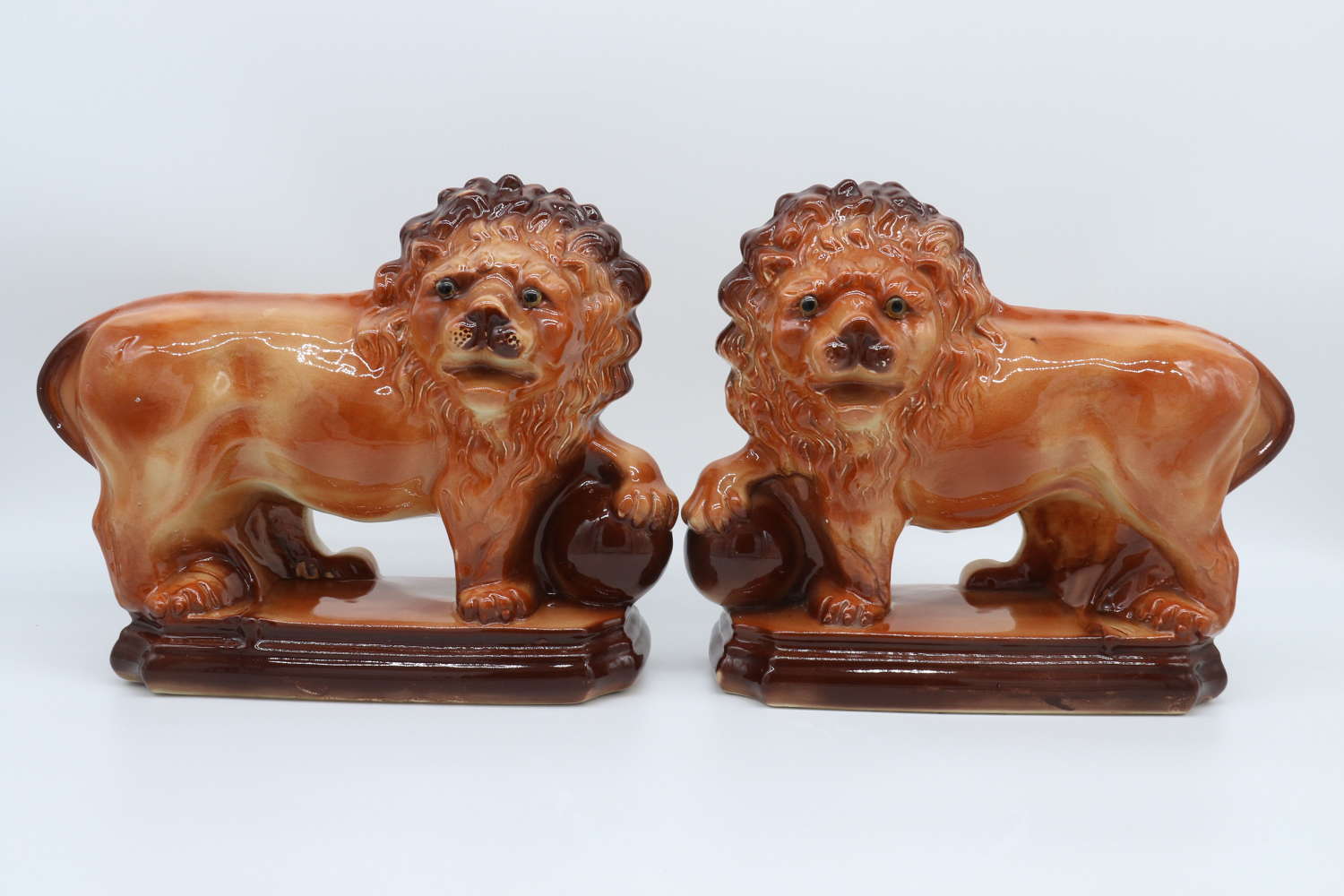A pair of early 20th c pottery Medici lions made by Lancaster and Sons