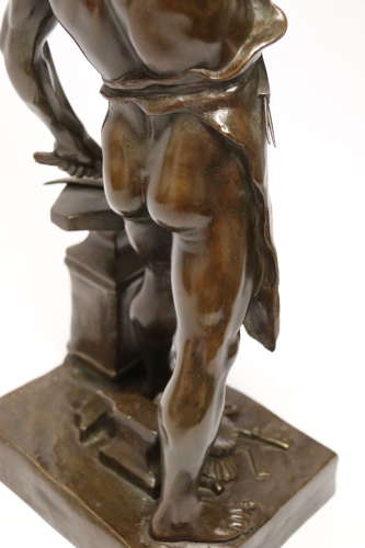 A late 19th C bronze sculpture of a blacksmith by E L Picault