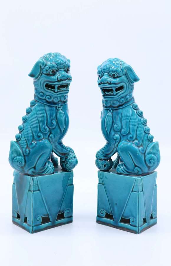 A pair of porcelain Chinese Buddhist Temple lions or foo dogs C 1900