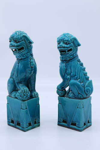 A pair of porcelain Chinese Buddhist Temple lions or foo dogs C 1900