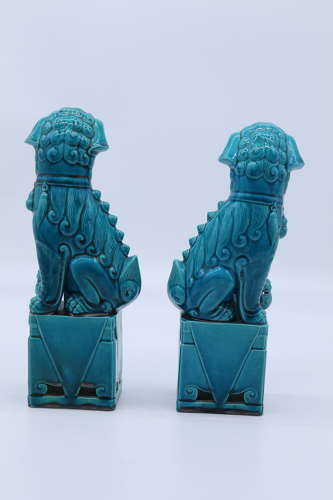 A pair of porcelain Chinese Buddhist Temple lions or foo dogs C 1900