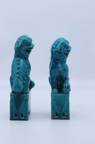 A pair of porcelain Chinese Buddhist Temple lions or foo dogs C 1900