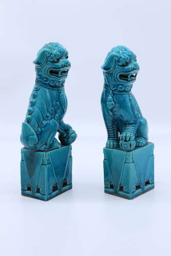 A pair of porcelain Chinese Buddhist Temple lions or foo dogs C 1900
