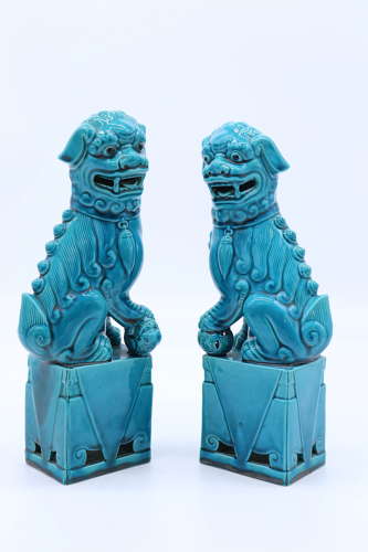 A pair of porcelain Chinese Buddhist Temple lions or foo dogs C 1900