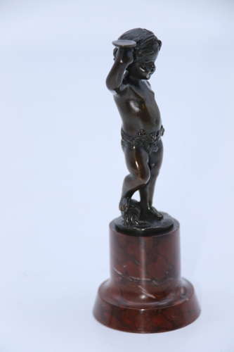 A pair of 19th century bronze putti figures on marble bases circa 1860