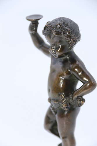 A pair of 19th century bronze putti figures on marble bases circa 1860