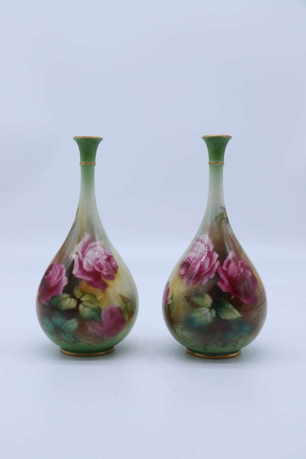 A  pair of Hadley’s Royal Worcester hand painted vases dated 1907