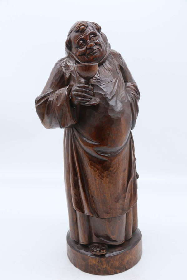 A Large Black Forest carved limewood study of a monk, circa 1900