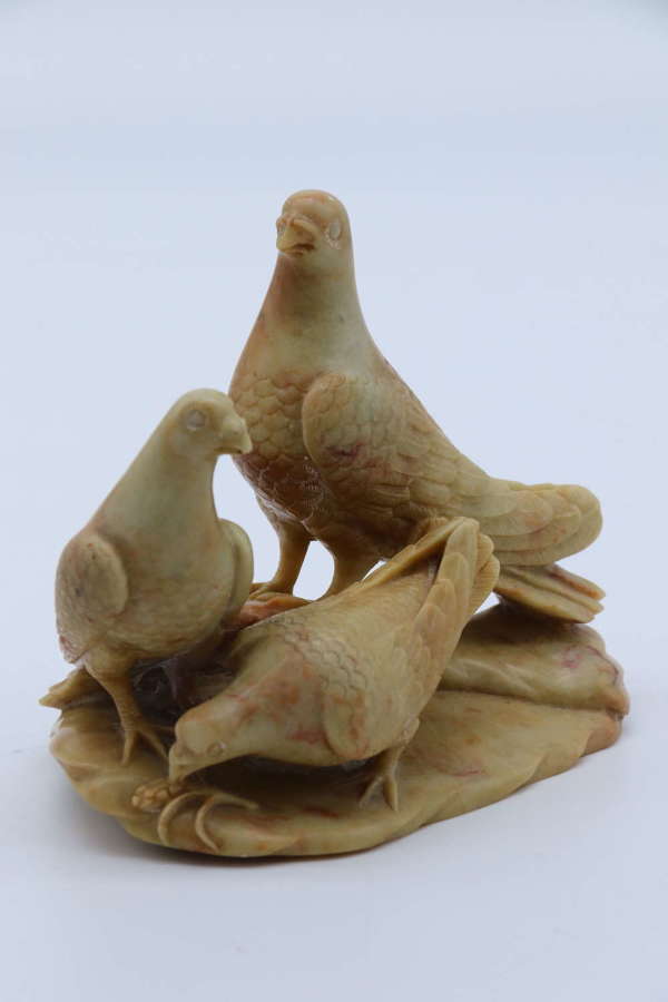 A 19th c Chinese soapstone carved figure group of three pigeons c 1895