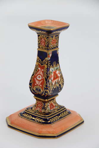 A pair of hand painted Royal Crown Derby candlesticks, circa 1911