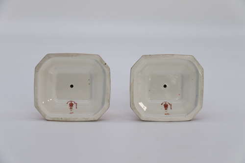 A pair of hand painted Royal Crown Derby candlesticks, circa 1911