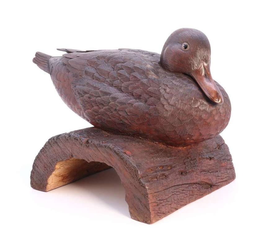 A Black Forest linden wood study of a perched mallard duck