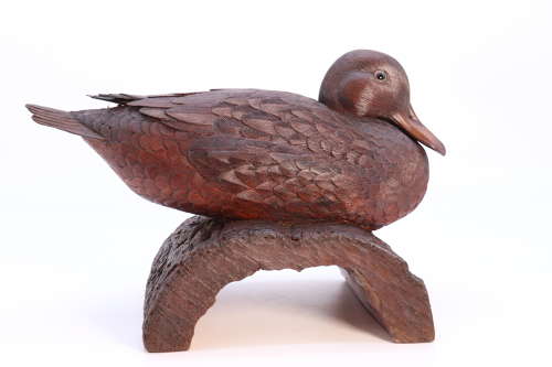 A Black Forest linden wood study of a perched mallard duck