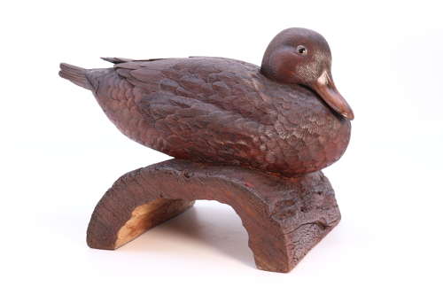 A Black Forest linden wood study of a perched mallard duck