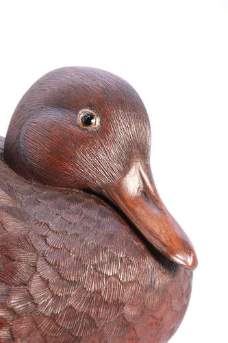 A Black Forest linden wood study of a perched mallard duck