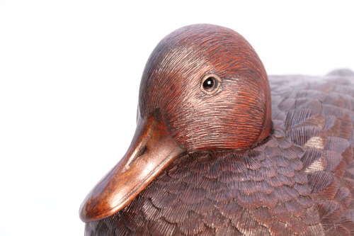 A Black Forest linden wood study of a perched mallard duck