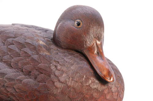 A Black Forest linden wood study of a perched mallard duck