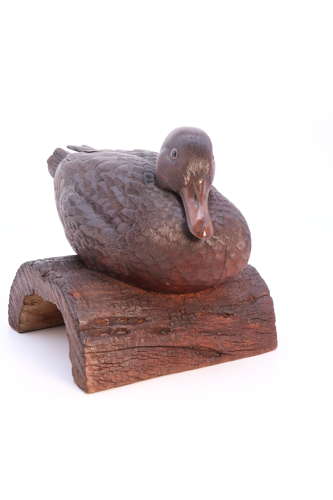 A Black Forest linden wood study of a perched mallard duck