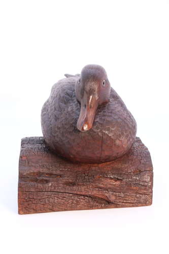 A Black Forest linden wood study of a perched mallard duck